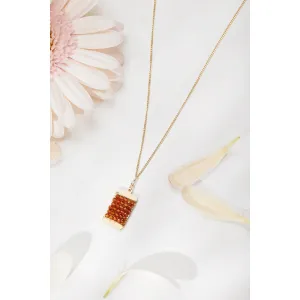 Wrapped Tag Necklace 4987 with Hessonite Beads and a Freshwater Pearl by Michelle Pressler Jewelry